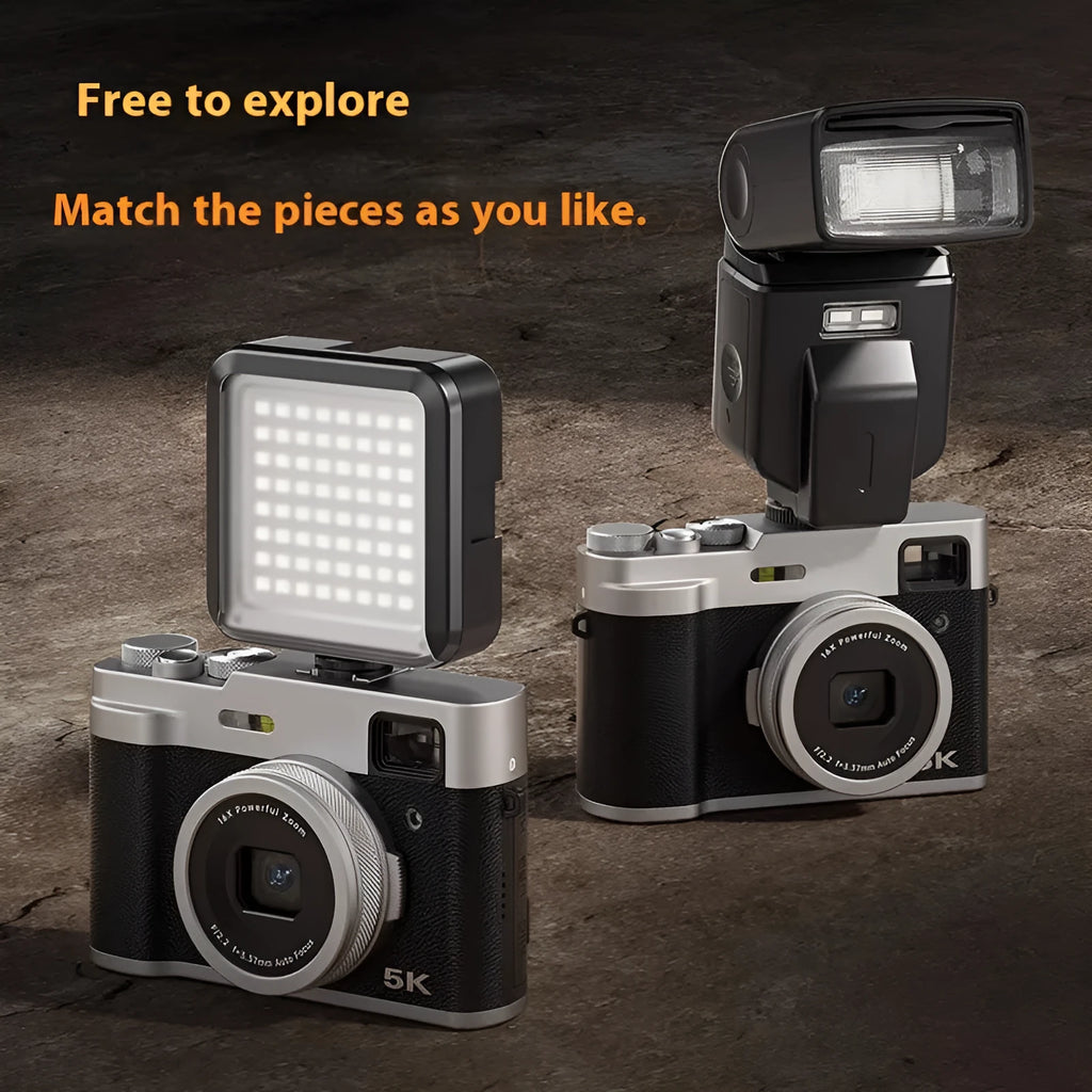 Black 5K HD digital camera with dual lenses, optical viewfinder, and 2.88-inch screen on a table