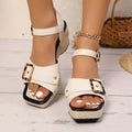 Pair of female button metal buckle beach chunky heel sandals in black with square toe and rubber sole
