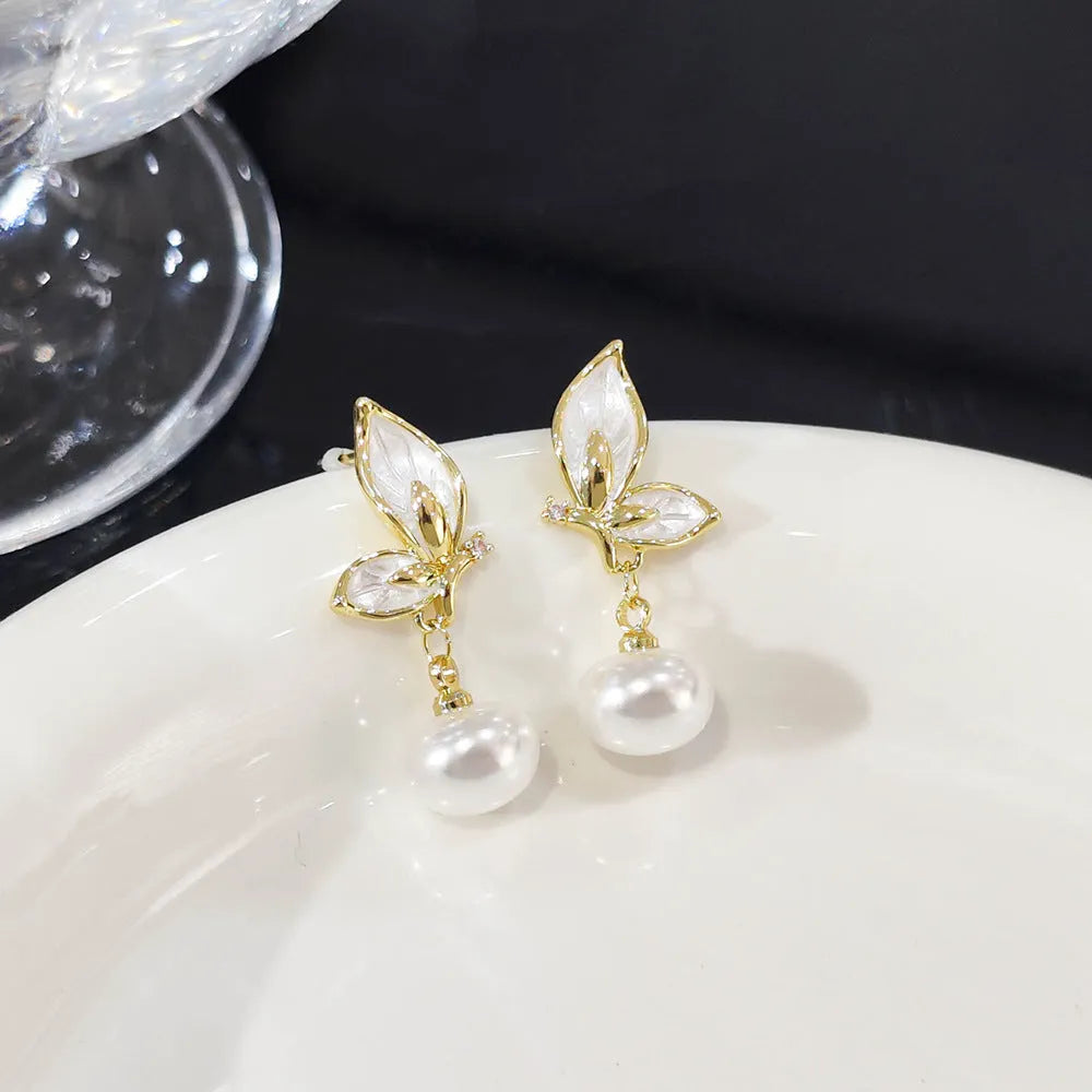 Gold-coloured butterfly earrings with zircon painting detail on copper metal for women