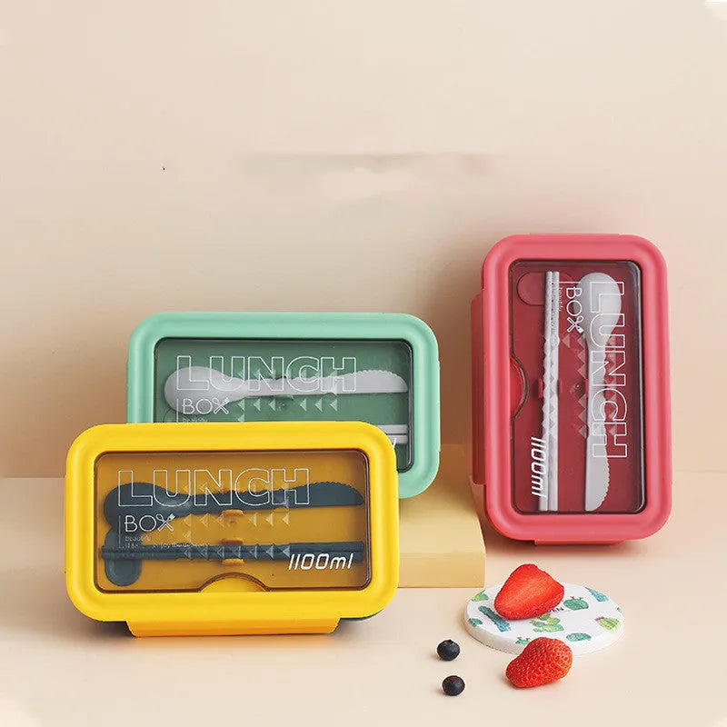 Green partitioned bento box with four compartments showing Japanese style and Nordic design