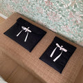 Women's black and white quilted laptop bag with decorative bow in two size options