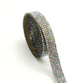 Long glass strip with self-adhesive backing for clothing decoration, shown in white and AB colour.