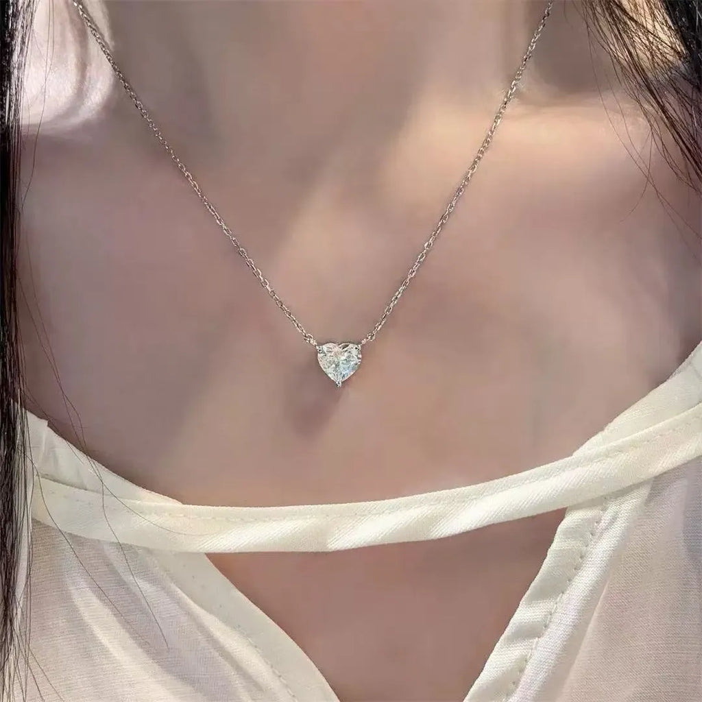Women's silver heart necklace with simple pendant on chain