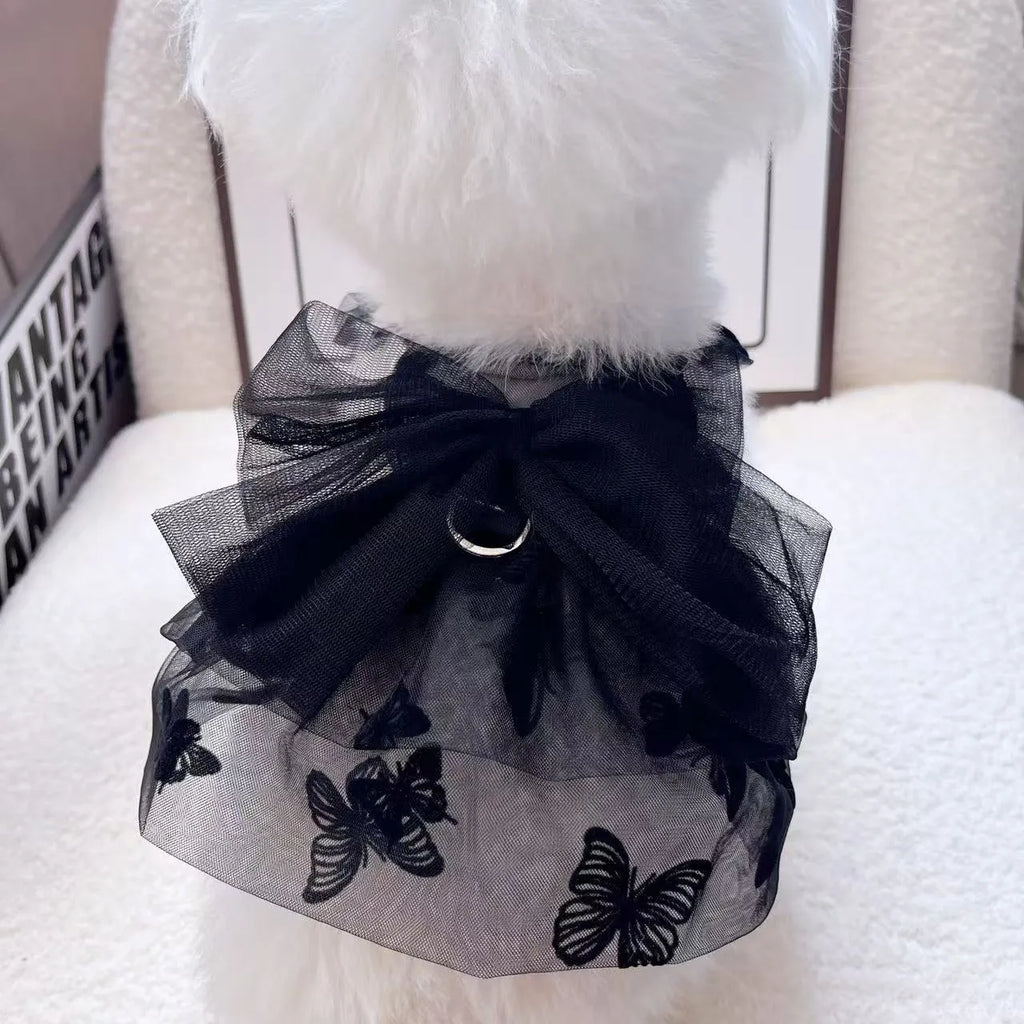 Black tulle princess skirt costume on small dog, showing tiered gauze design and adjustable fit.