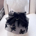 Black tulle princess skirt costume on small dog, showing tiered gauze design and adjustable fit.