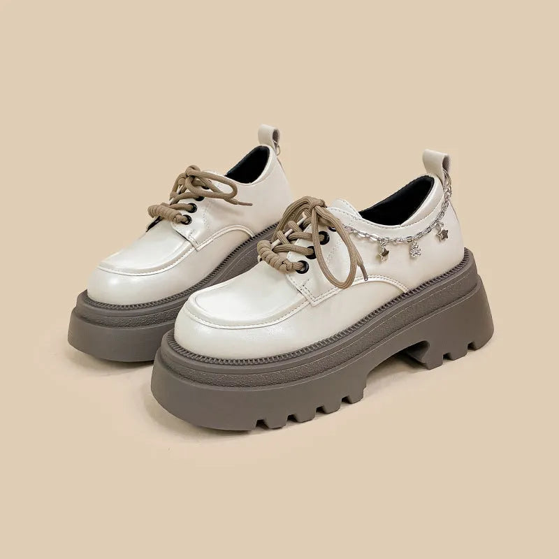 British-style white platform leather shoes with chunky heel and front lace-up closure