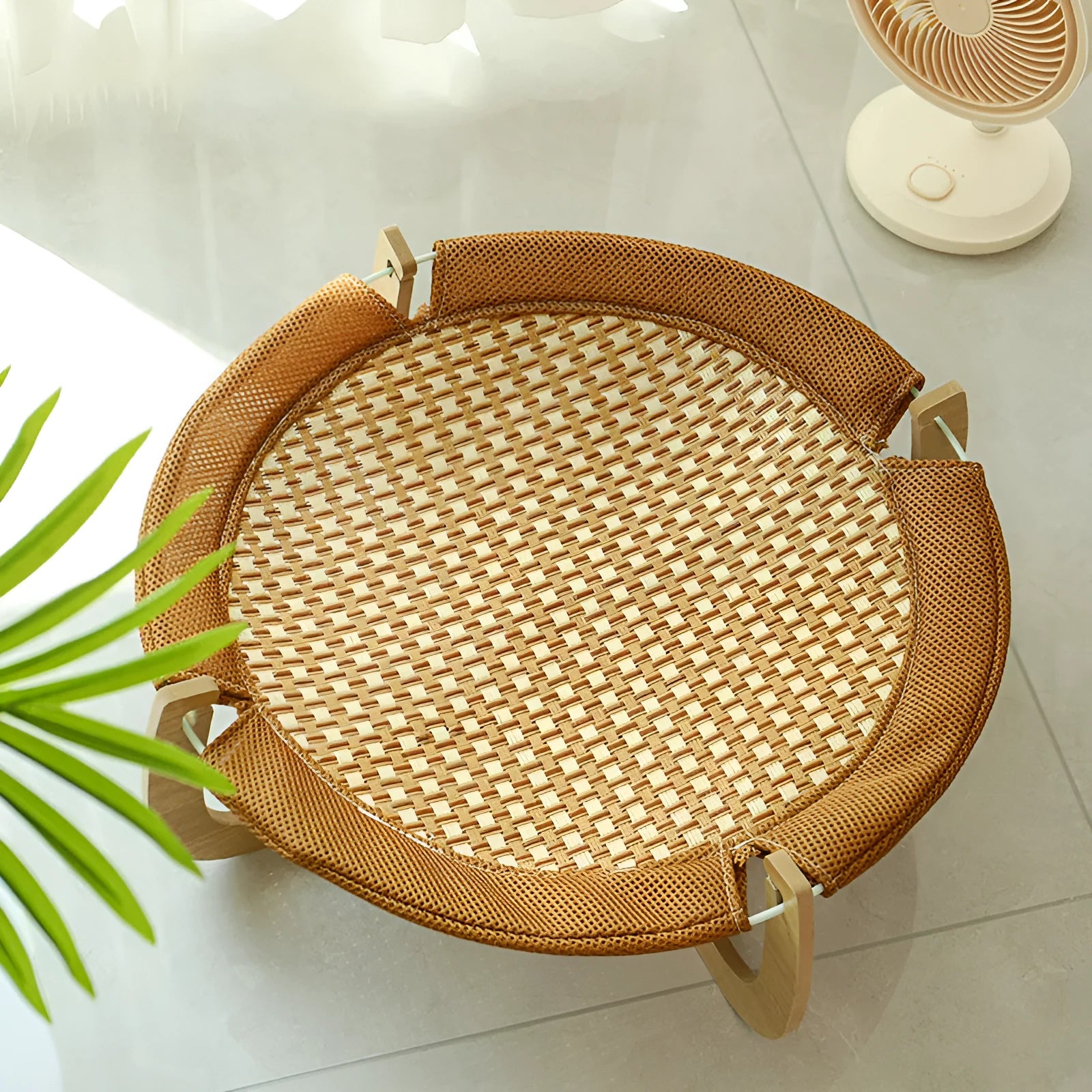 Brown woven rattan pet bed measuring 46 cm square with raised sides for cats and small dogs