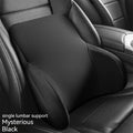 Black memory foam car lumbar support pillow and headrest pillow set on a car seat.