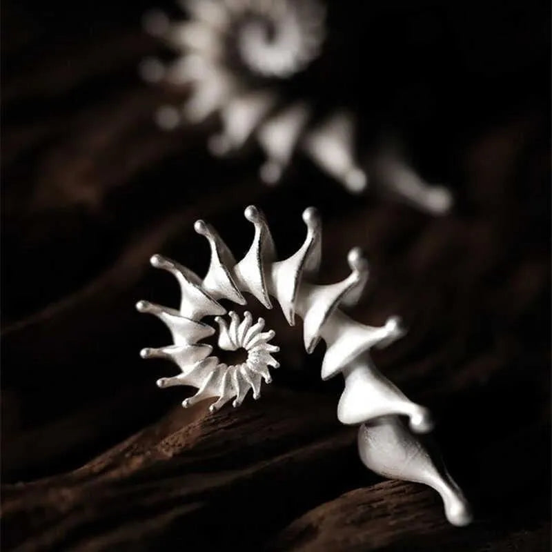 Exaggerated three-dimensional conch matte finish stud earrings with irregular shape