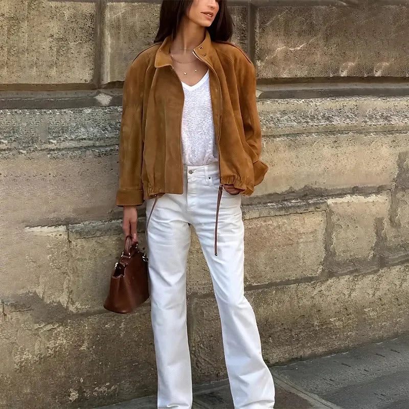 Loose-fit solid colour polyester jacket with long sleeves on a model.