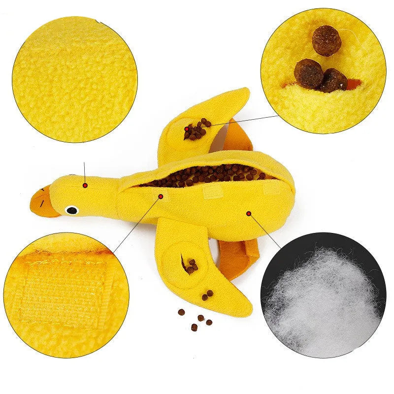 Yellow plush teddy duck dog training toy with squeaker and treat dispensing compartment.