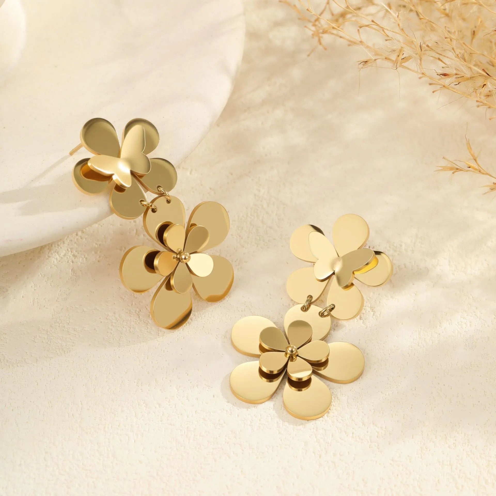 Women's stainless steel earrings with 18K gold electroplated flower butterfly design and post backs