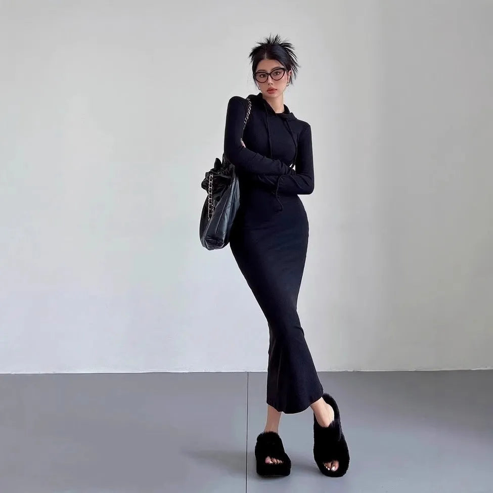 Women's grey hooded long-sleeve sheath dress with a high waist on a model.