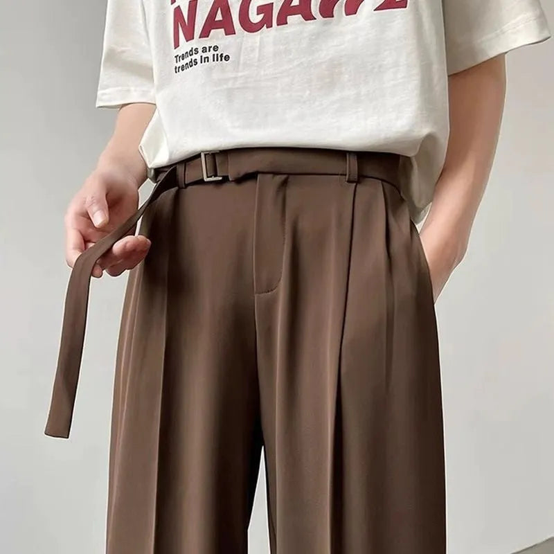Black straight leg loose cut pants with non-iron chemical fibre blend fabric, front view