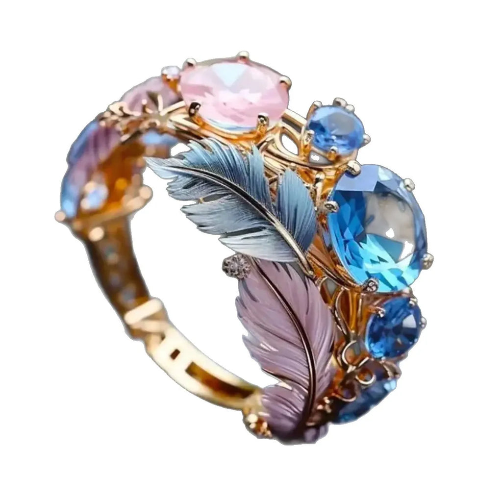 Geometric gold brass ring with colourful embossed feather design and zircon detailing