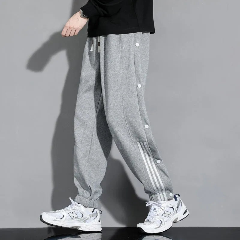 Men's loose cotton blend sweatpants with ankle-tied cuffs in black colour