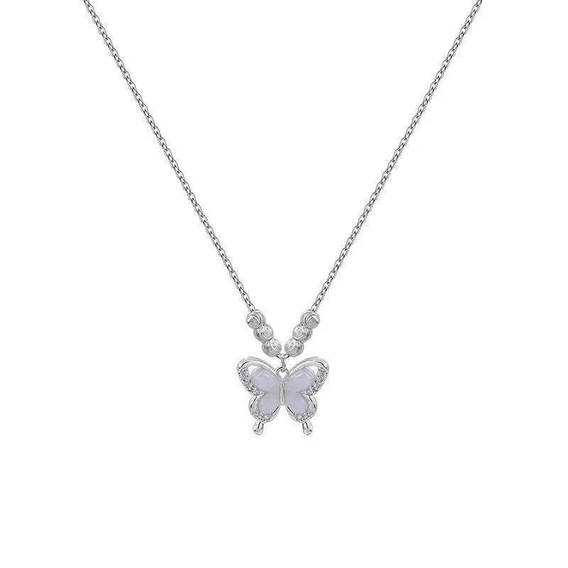 A silver necklace with a butterfly pendant on a cross chain, showing adjustable length.