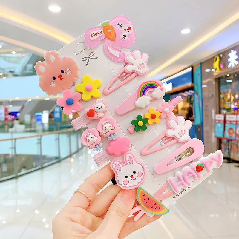 14-piece toddler hair accessories set: colourful rainbow, fruit, and butterfly barrettes in soft silicone clay.