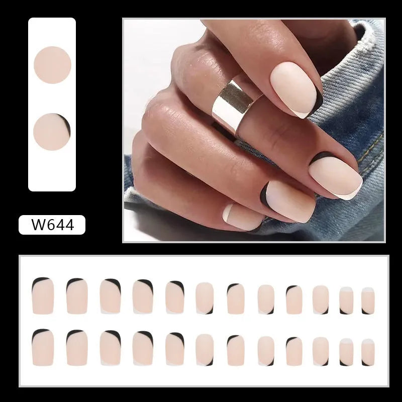 Black and white frosted gel manicure set with plastic nail armour pieces.