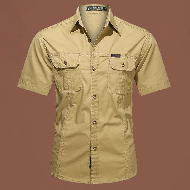 Men's short sleeve cotton work shirt in a loose fit, shown in a choice of colours including army green and blue.