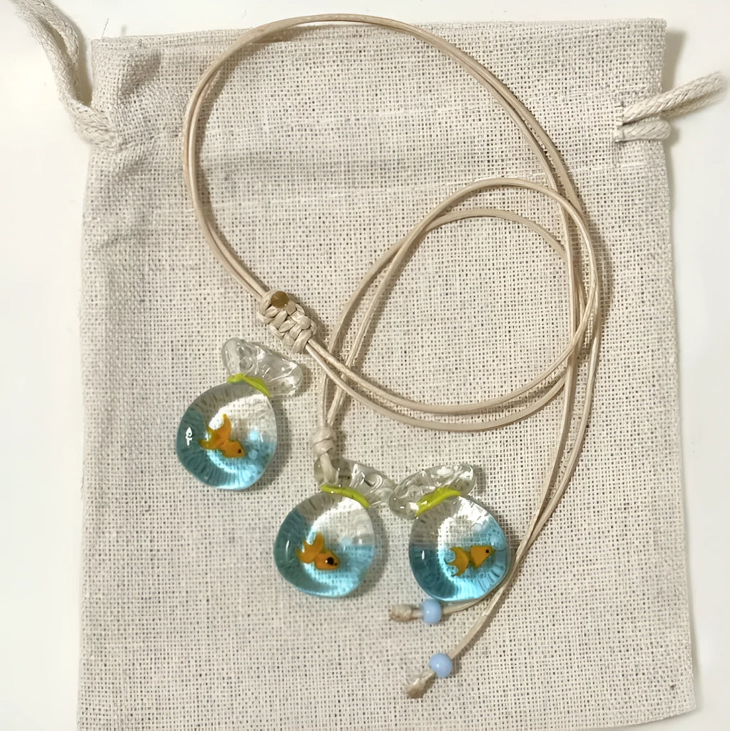 Women's pendant necklace with coloured glaze joker charm on cotton linen chain