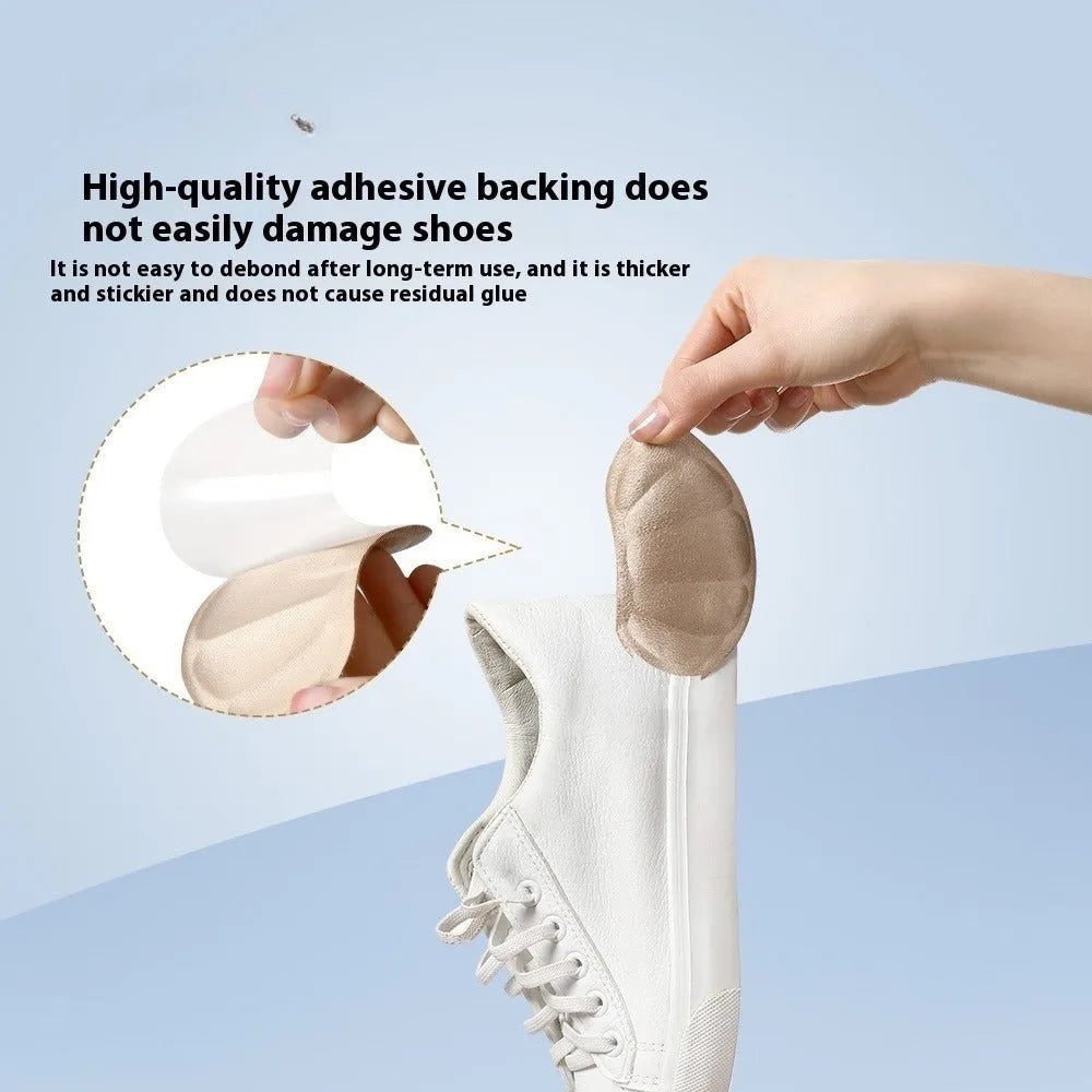 Three pairs of camel-coloured suede anti-slip heel cushion pads for shoes, shown with adhesive backing.