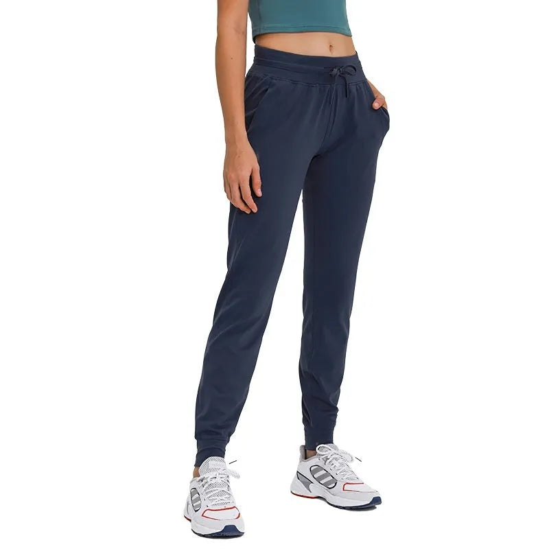 Women's high-waist yoga pants with drawstring waistband in quick-drying cotton blend fabric