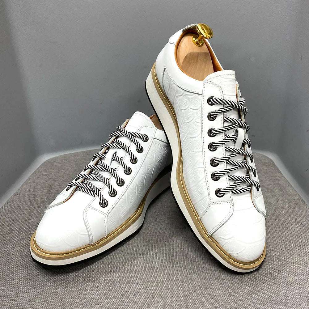 Men's low-top handmade shoes with an embossed pattern, shown in multiple colours with front lace-up detail.