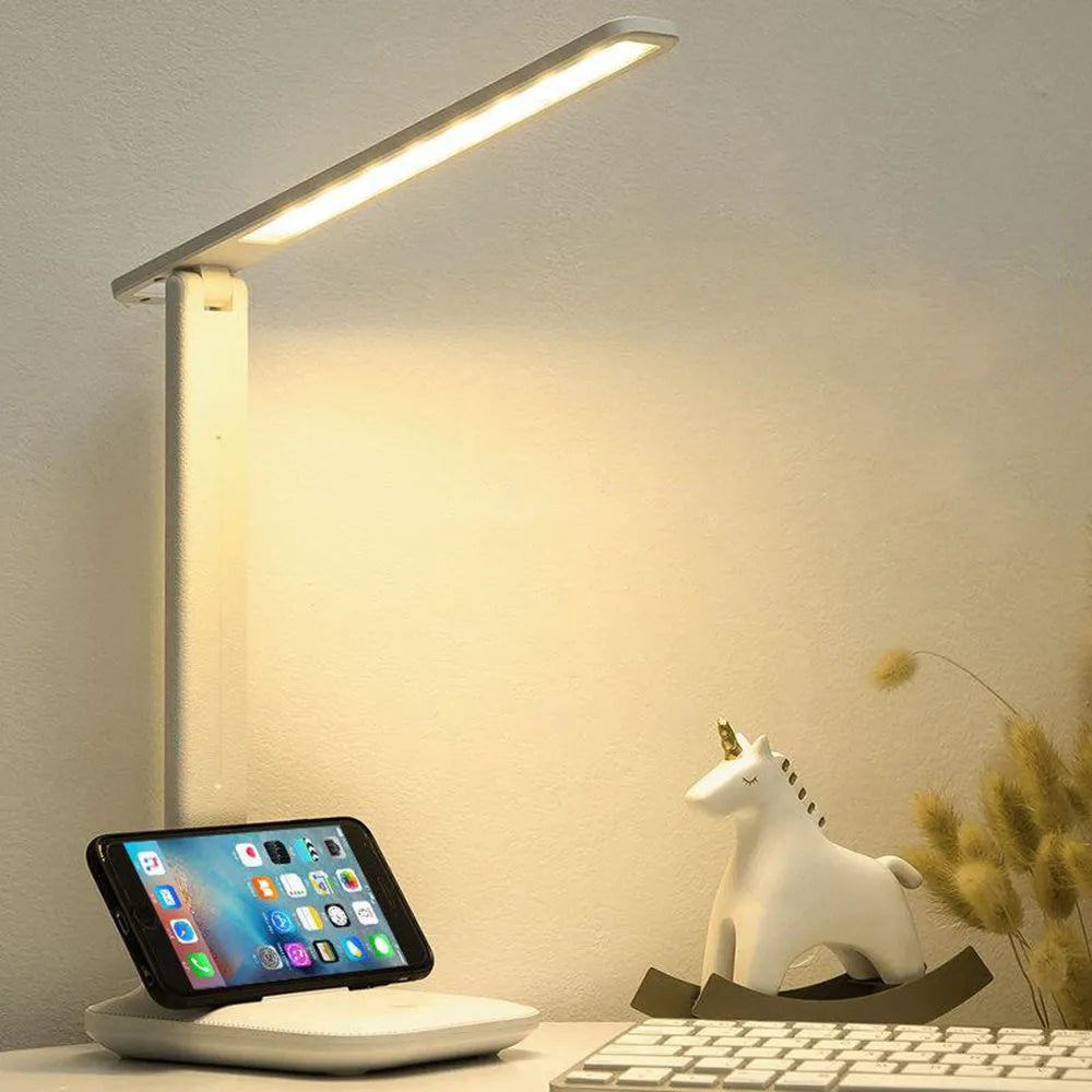 White plastic bedside lamp with touch controls and USB charging port