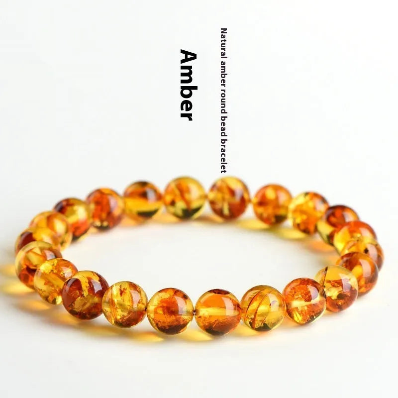 Natural yellow piebald amber bracelet with flower spot patterning and geometry beads