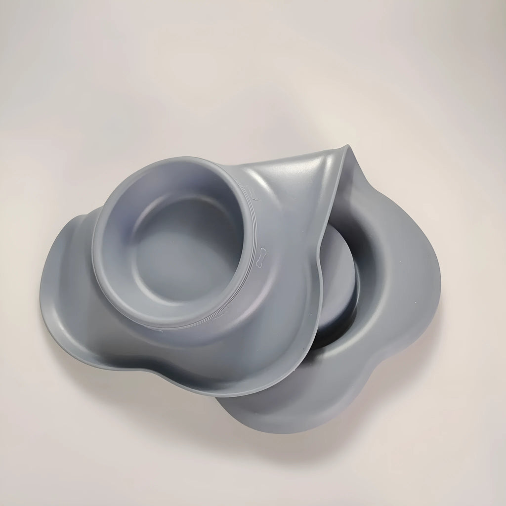 Large silicone dog bowl with stainless steel insert showing double compartment design for food and water separation
