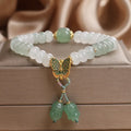 Tian Shan Cui green crystal abacus beads bracelet with butterfly tassel and pearl rhinestone sequin details, 17cm