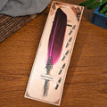 Vintage feather dip pen with zinc alloy shell in a choice of ten colours on a desk.