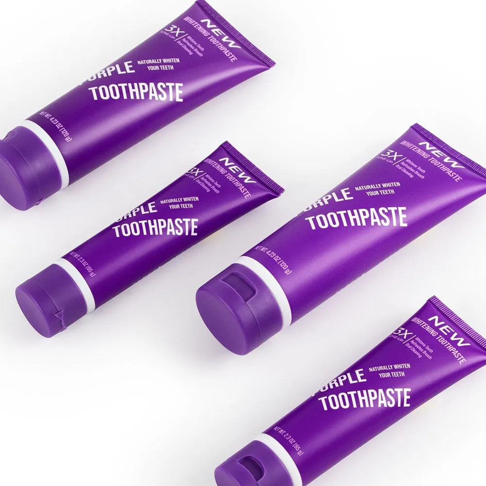 Purple whitening toothpaste tube for removing yellow stains from adult teeth, available in 120g and 65g sizes