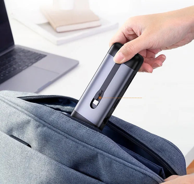 USB-C docking station showing HDMI, USB 3.0, VGA, and ethernet ports on a 9-in-1 model with short connecting cable.