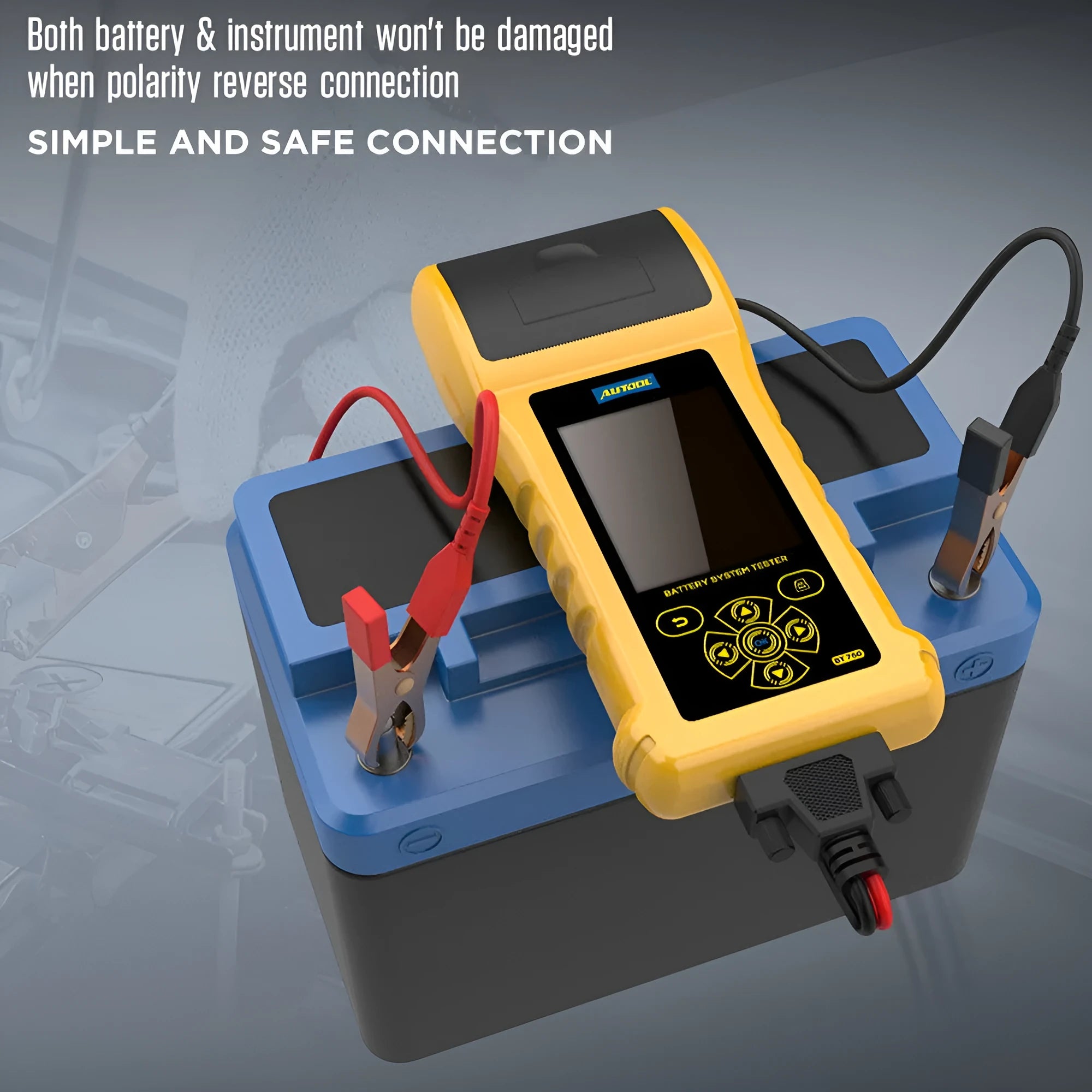 Autool BT760 car battery tester with colour screen and attached battery clips on a workbench