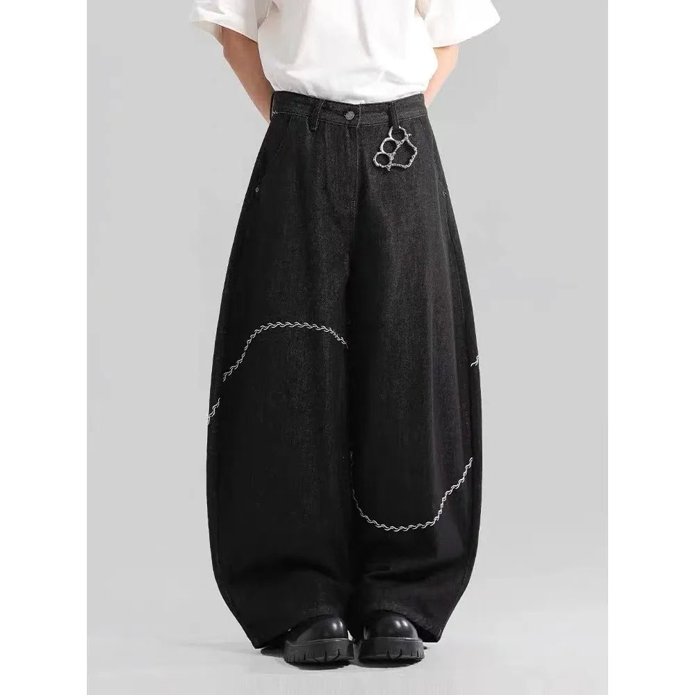 Black Pu Shuai straight-leg denim trousers with a mid waist and zip fly, laid flat.