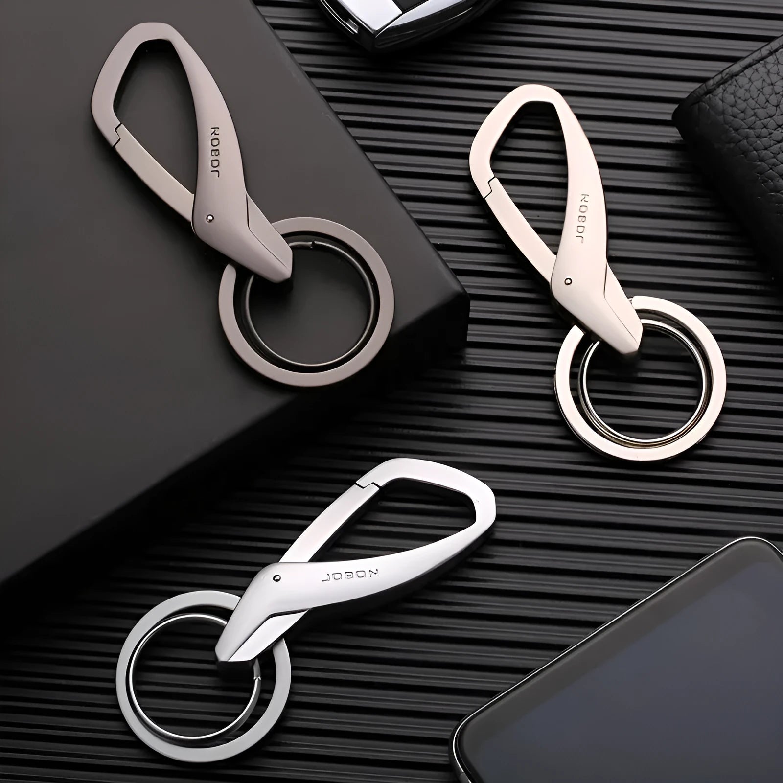 Zinc alloy double ring car keychain in black, chrome, or nickel colour.