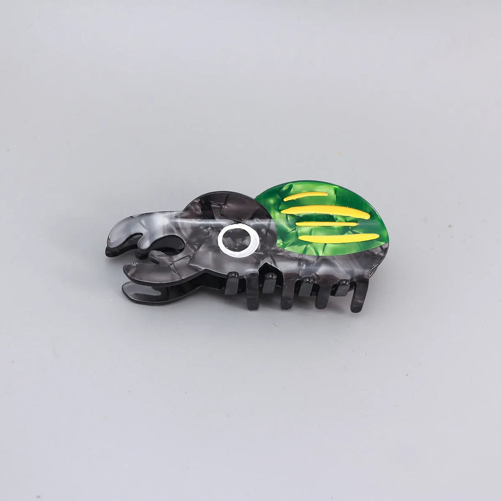 Handmade cellulose acetate beetle grip in green colour with cartoon design