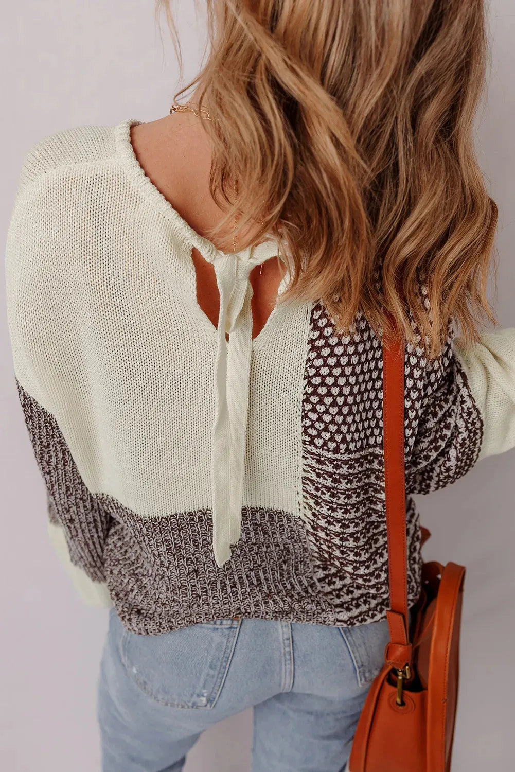 Dark khaki women's sweater with colour block design, drop shoulders, and a back tie.