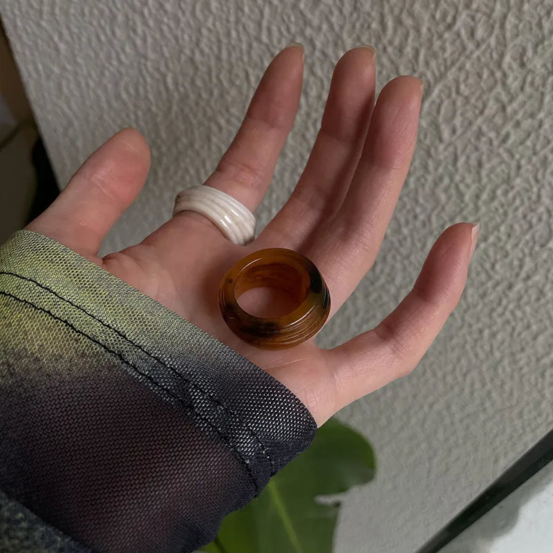 Geometric irregular resin wide ring in Maillard Brown, Smoky Brown, and Latte White colours