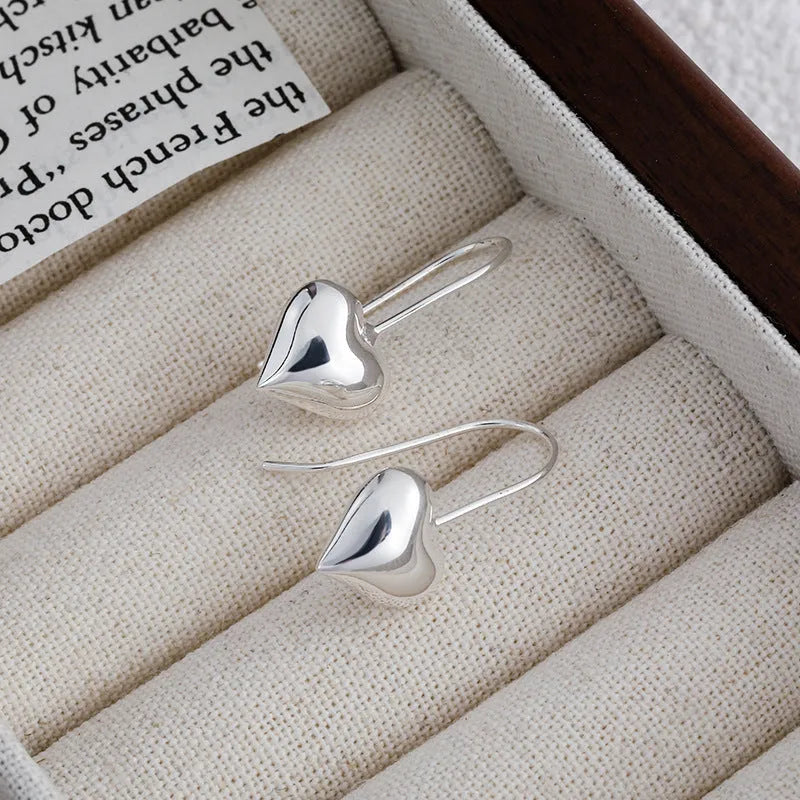 Three-dimensional glossy heart earrings with Korean style silver tone finish
