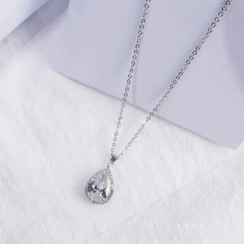 Women's rose gold drop shape necklace with rhinestone details on an alloy chain.