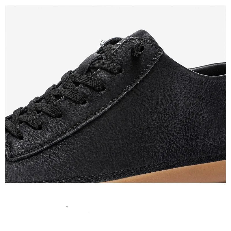 Men's black leather casual lace-up shoes with a round toe and flat rubber sole.