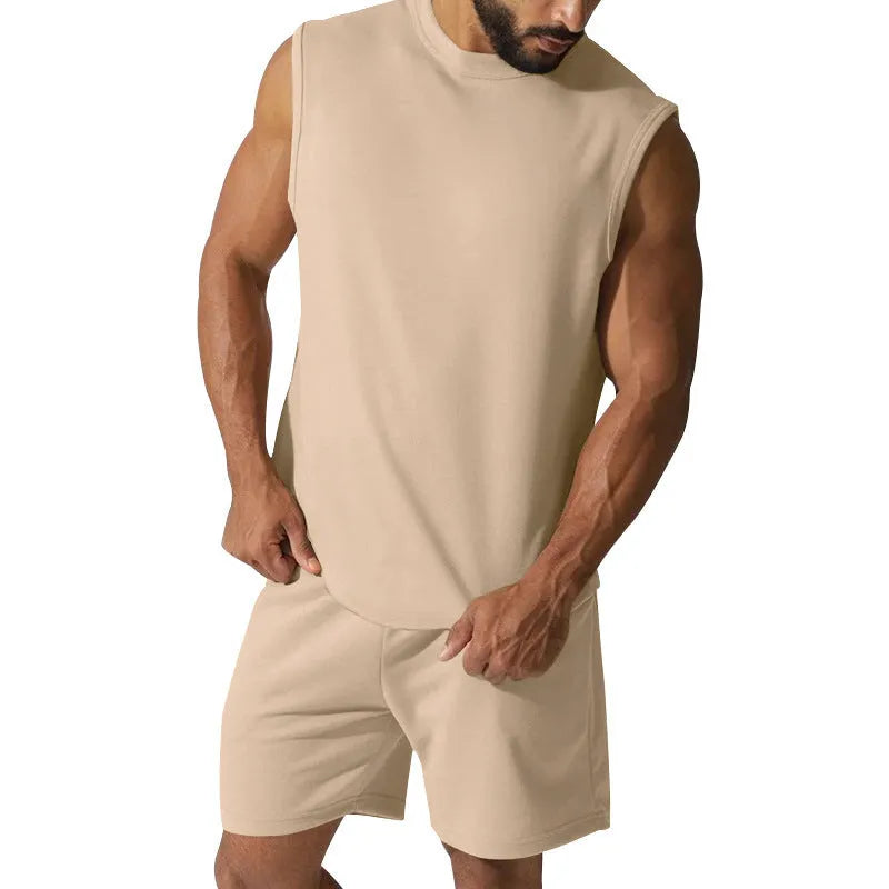 Men's sleeveless cotton blend sports top and shorts set in a solid colour on a mannequin.