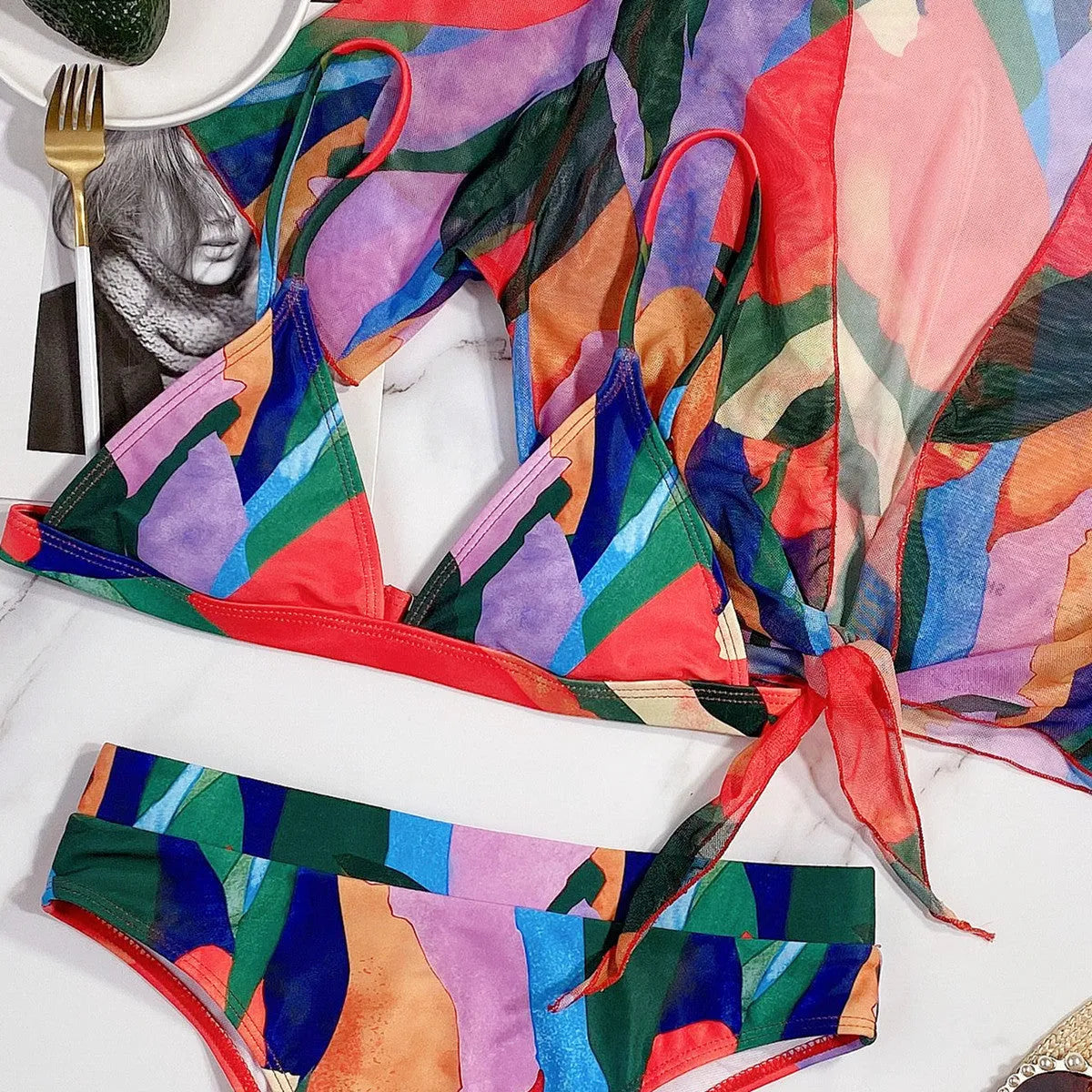 Red printed women's split swimsuit in nylon fabric for swimming.