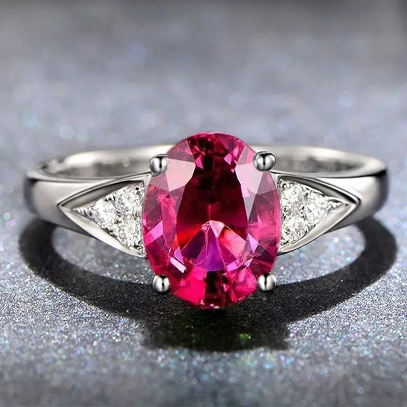 Close-up of a women's court ring with a blue natural zircon inlay forming a heart shape.