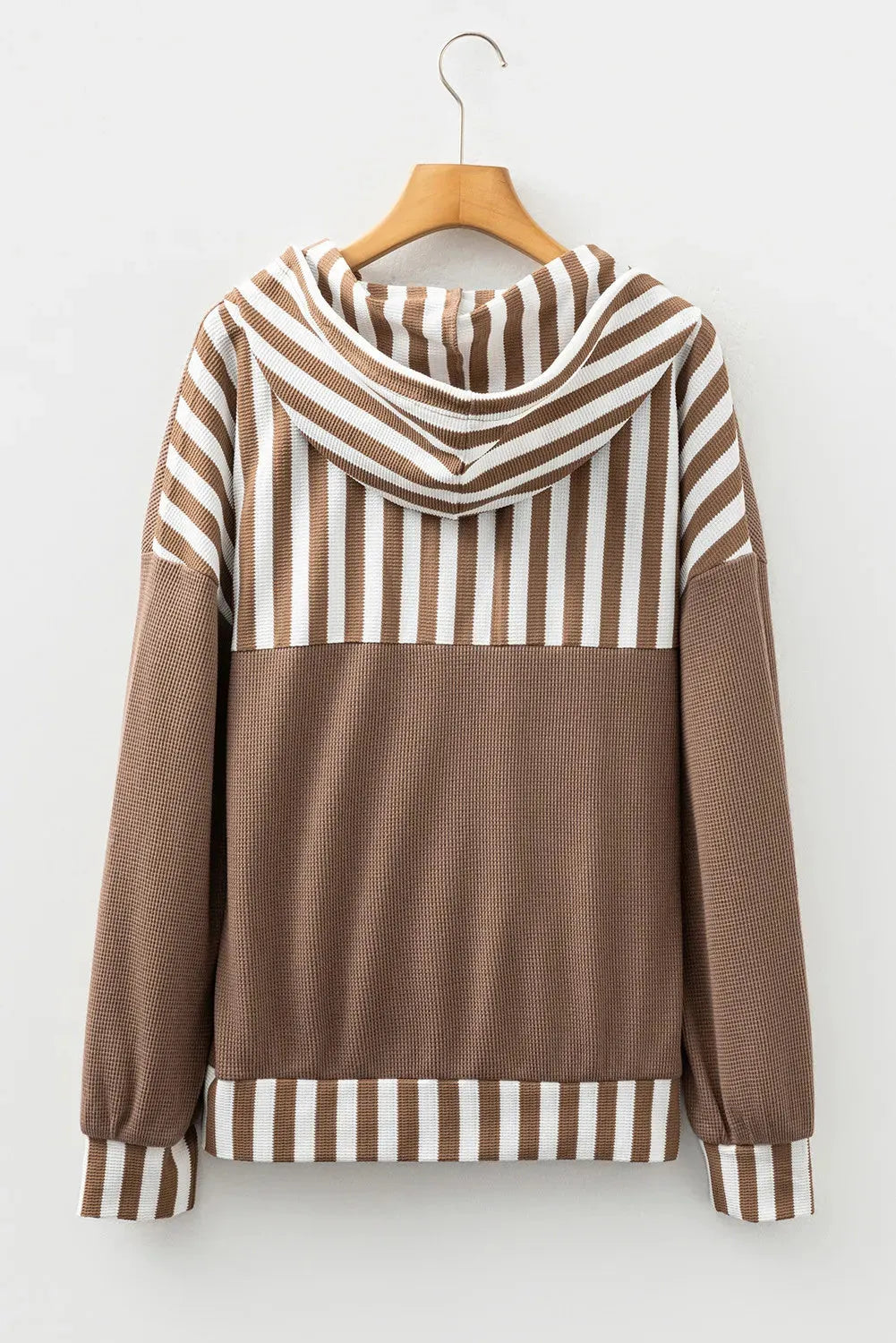 Straw yellow long sleeve hoodie with waffle texture, striped patchwork, button neck, and drawstring hood.