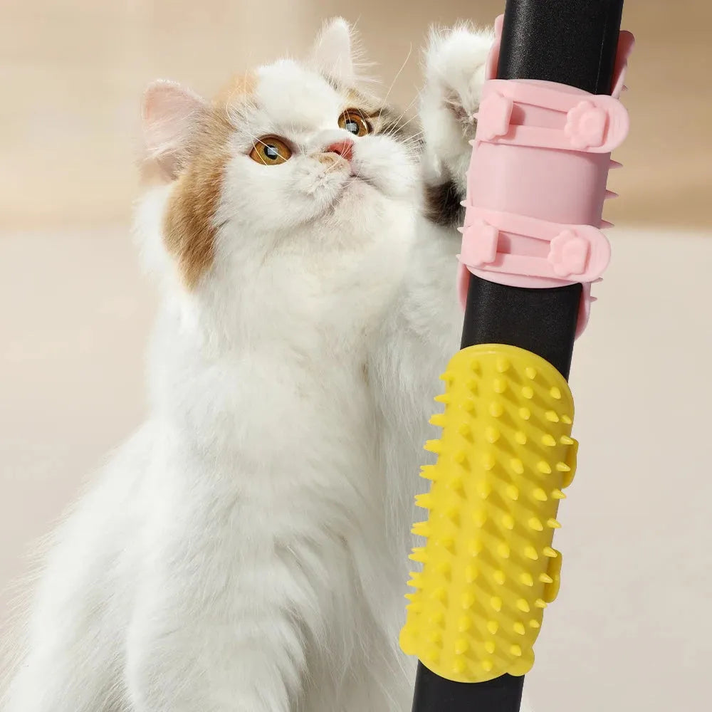 Silicone cat grooming comb with adjustable strap mounted on a table leg
