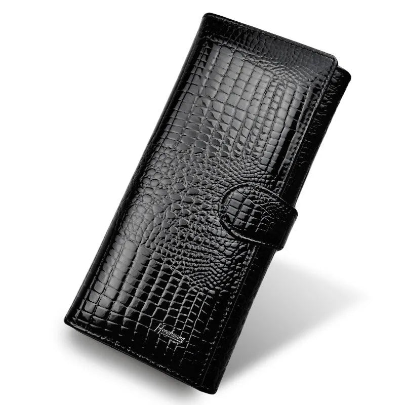 Women's patent leather coin purse with crocodile pattern in red colour showing pigskin lining interior
